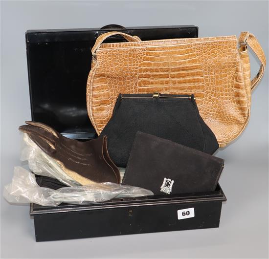 A collection of vintage clutch bags and gloves
